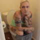 A blonde woman with tattoos records herself pissing, farting and shitting while sitting on a toilet. She spends a lot of time talking about her stomach cramps and bathroom visits. Over 14 minutes.